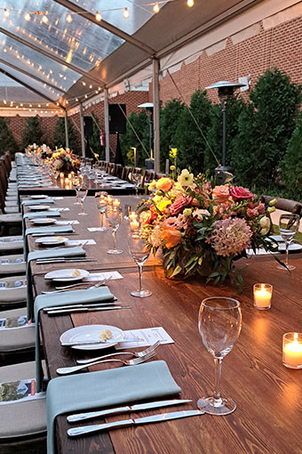 Long outdoor wedding reception table seating at Kimpton Forum Hotel under tent