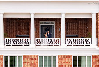 bride and groom on kimpton forum hotel balcony
